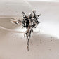 Adjustable silver ring with a graceful angel design, perfect for any occasion.