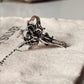 Beautiful sterling silver ring with an adjustable band and angel motif.