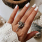 Celestial adjustable silver ring featuring an angel wing design.