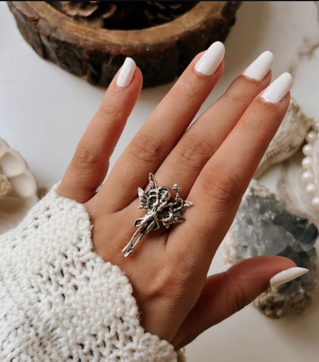Celestial adjustable silver ring featuring an angel wing design.