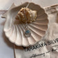 Vibrant aquamarine gemstone pendant in silver with a boho-inspired look.