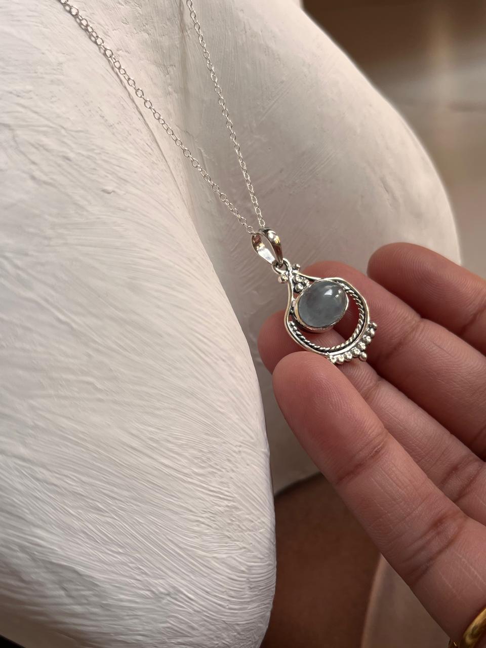 Elegant aquamarine silver pendant with a boho-inspired design.