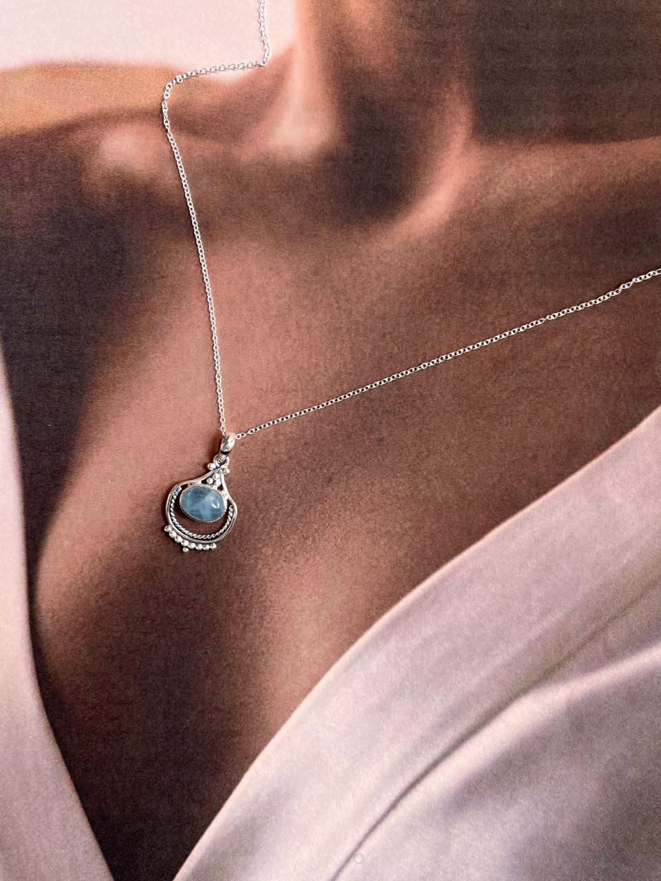 Handcrafted aquamarine boho silver pendant with intricate detailing.