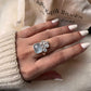 Aquamarine and blue topaz gemstone cluster ring in sterling silver
