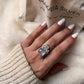 Sterling silver ring with a single aquamarine and blue topaz cluster