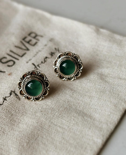 Sterling silver earrings featuring large green onyx floral studs