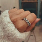 Handcrafted adjustable silver 925 ring with twisted braided pattern