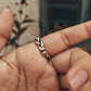 Chunky silver 925 ring with adjustable band and braided twist design