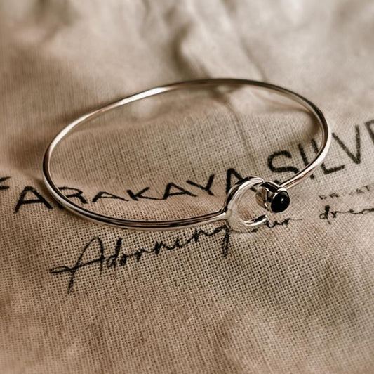 Adjustable silver kada with black onyx crescent moon accent