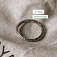 Tribal Edge 925 silver ring featuring unique half and half design, showcasing intricate patterns on a soft fabric background.