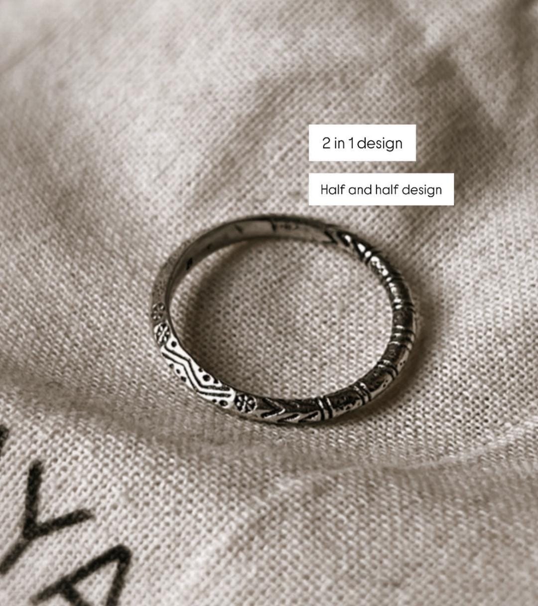 Tribal Edge 925 silver ring featuring unique half and half design, showcasing intricate patterns on a soft fabric background.