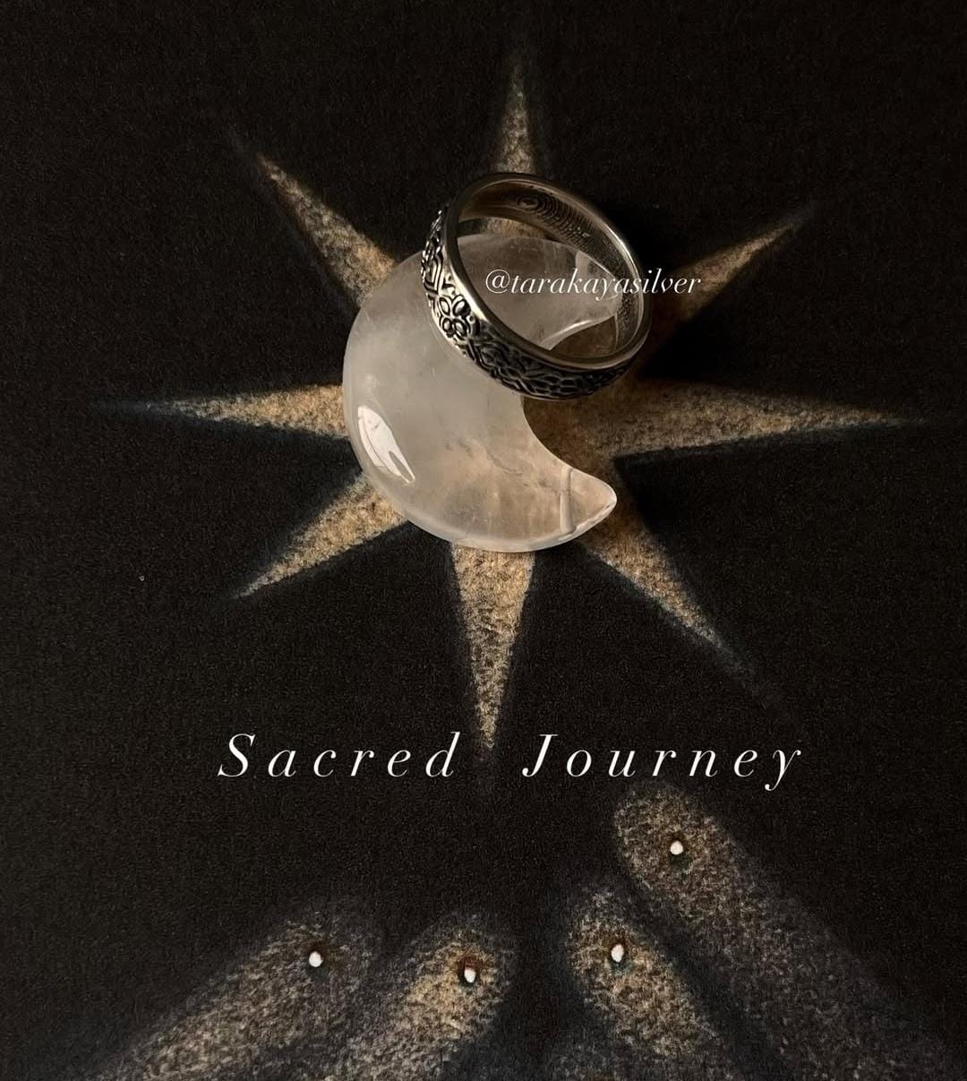 Sacred Journey 925 silver ring displayed on a celestial-themed background with a crescent moon design.