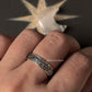 925 silver ring with intricate floral design worn on a hand, showcasing a unique and handmade jewelry piece.