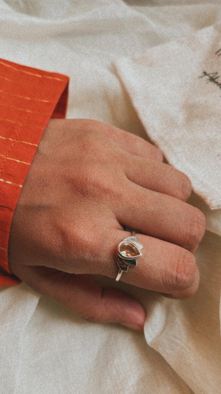 Citrine gemstone in a divine lotus silver ring with artistic detail
