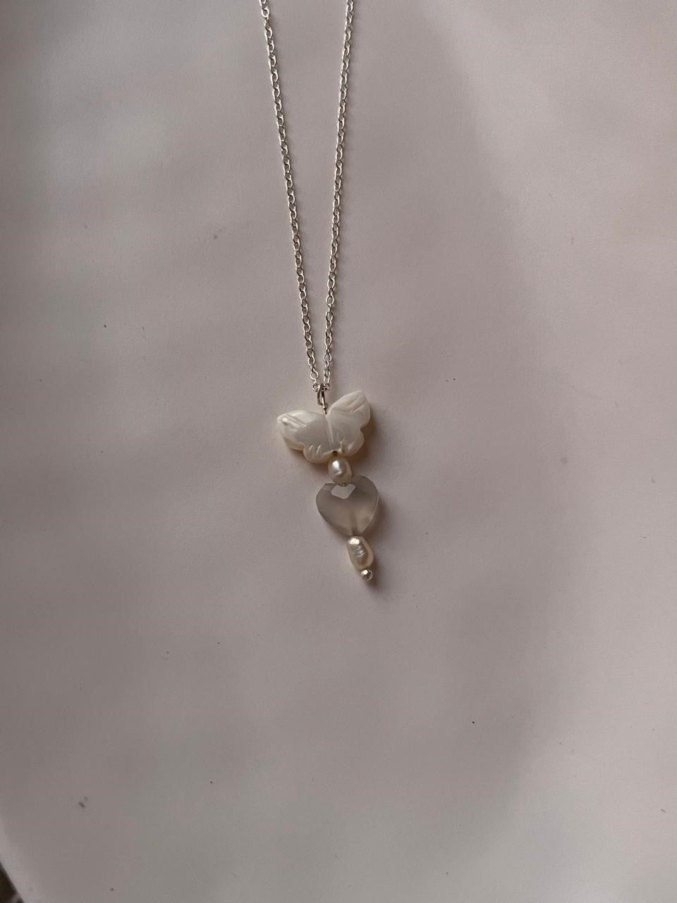 Handcrafted silver necklace with Mother of Pearl butterfly, Grey Moonstone heart, and Fresh Water Pearls