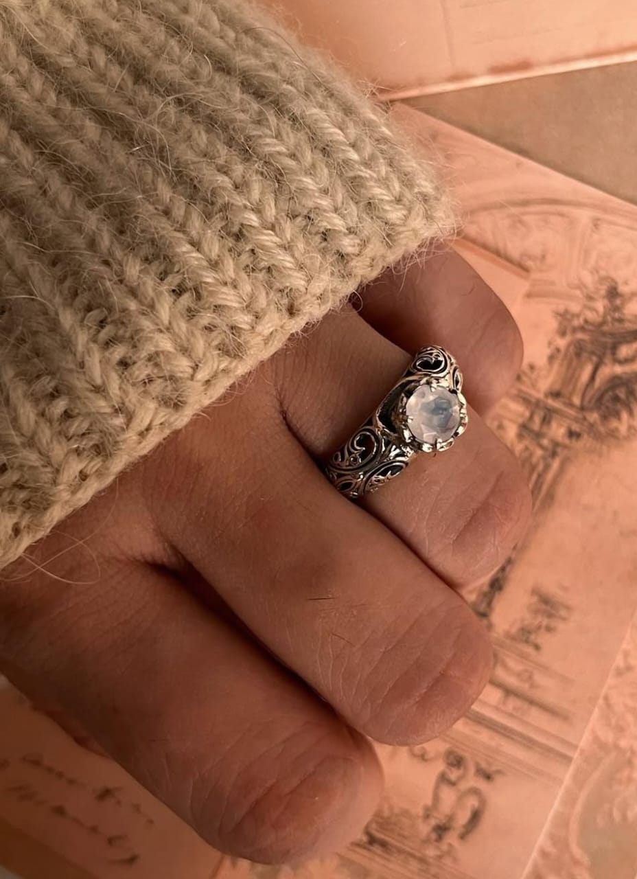 Solitaire moonstone stone set in vintage silver band