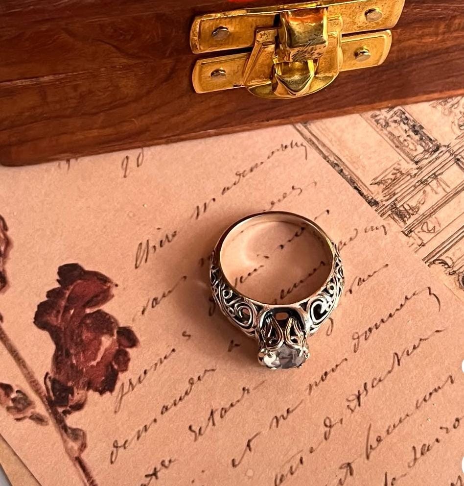 Solitaire moonstone stone set in vintage silver band