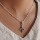 Unique Fleur De Lis silver pendant with a detailed, ornamental design