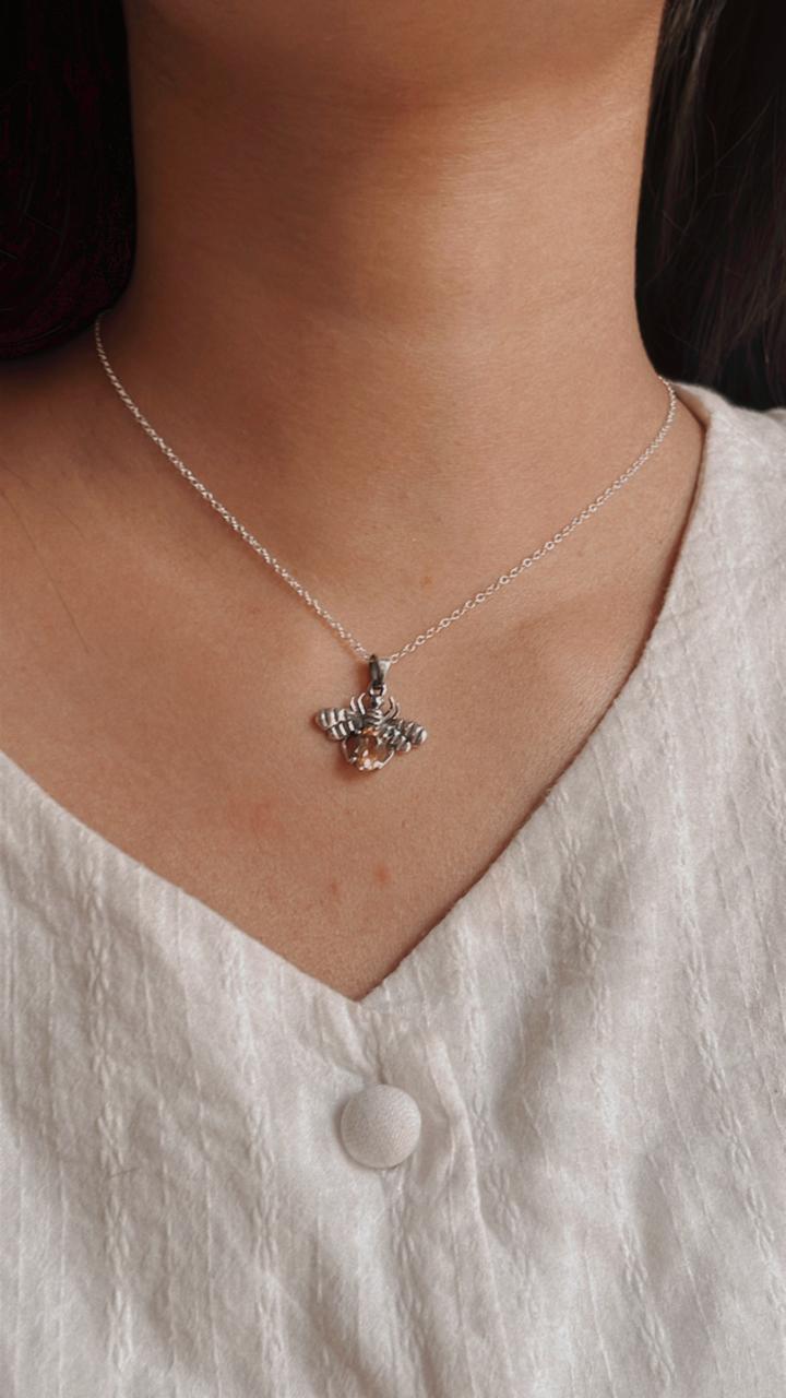 Unique bee design silver pendant with a radiant citrine stone.