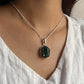 Sterling silver pendant featuring a carved green jade Ganesh