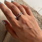 Charming rope band silver ring with rose quartz centerpiece