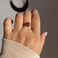 Sterling silver vintage ring featuring a square-cut garnet