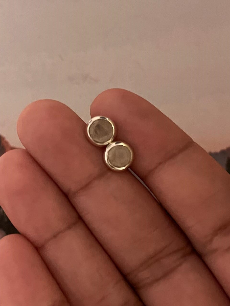 Close-up view of 6mm Rose Quartz Silver Stud Earrings