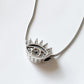 Elegant evil eye shaped CZ silver pendant with radiant gemstone details