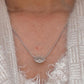 Stylish evil eye shape silver pendant with a sparkling CZ center