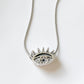 Modern evil eye shape silver pendant with a dazzling cubic zirconia
