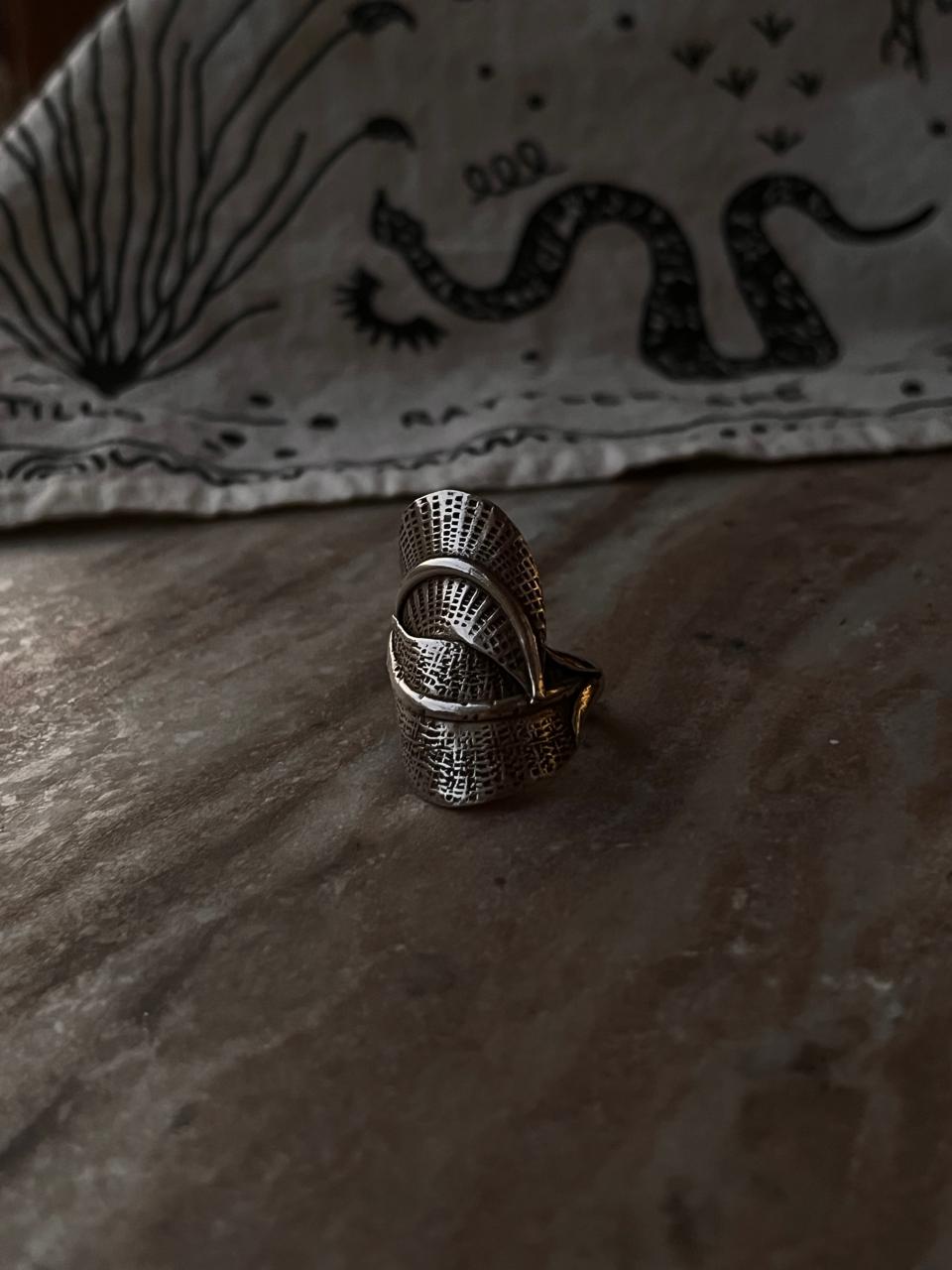Handcrafted silver adjustable ring with leaf wrap design  