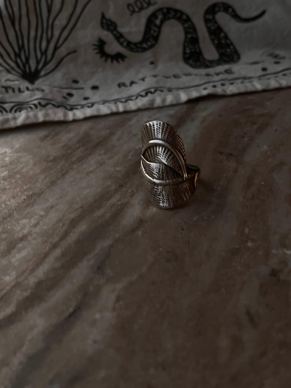 Handcrafted silver ring with elegant leaf wrap design  