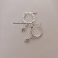 White Topaz North Star Charm on Plain Classic Hoop Earrings