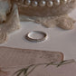 Minimalist 925 silver ring with white topaz accents  