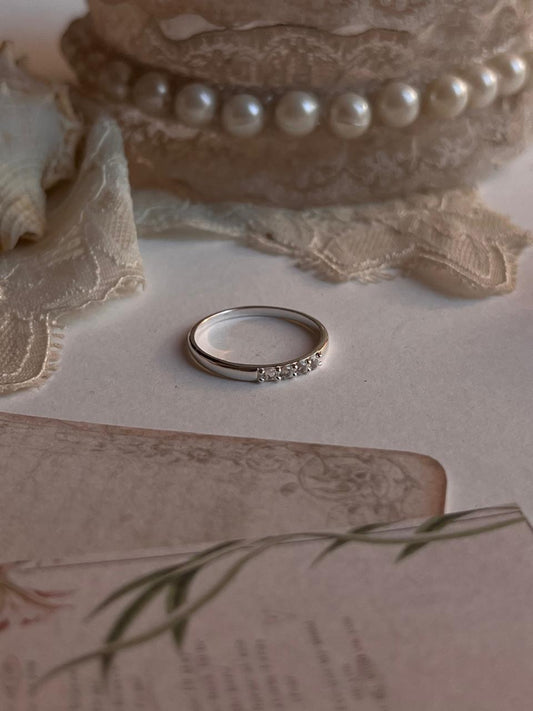 Minimalist 925 sterling silver ring with white topaz accents  