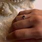 Black spinel solitaire ring with white topaz halo in 925 silver