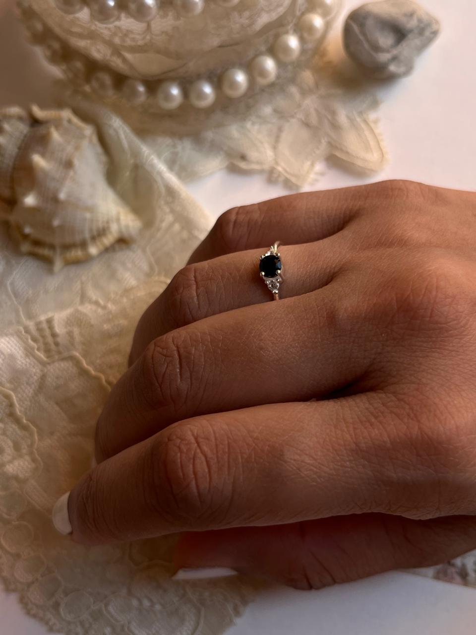 Black spinel solitaire ring with white topaz halo in 925 silver