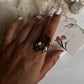 Sterling silver solitaire ring with vibrant green amethyst  