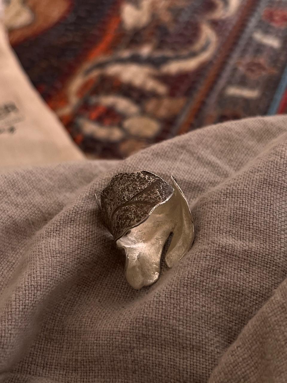 Adjustable silver ring with maple leaf wrap design and brushed texture