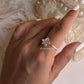 Minimal silver ring with white enamel plumeria flower