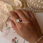 Delicate white enamel flower ring in 925 silver  