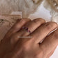 Leafy design silver ring featuring rhodolite garnet stone