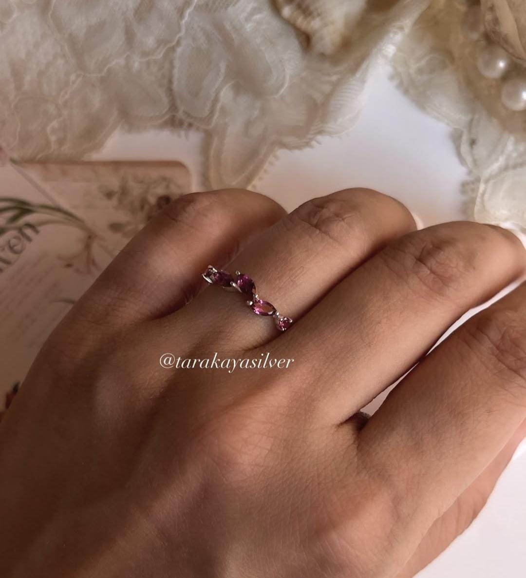 Leafy design silver ring featuring rhodolite garnet stone