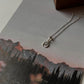 Small crescent moon necklace with labradorite charm in silver  