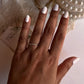 Three-stone white topaz ring on twisted silver band  