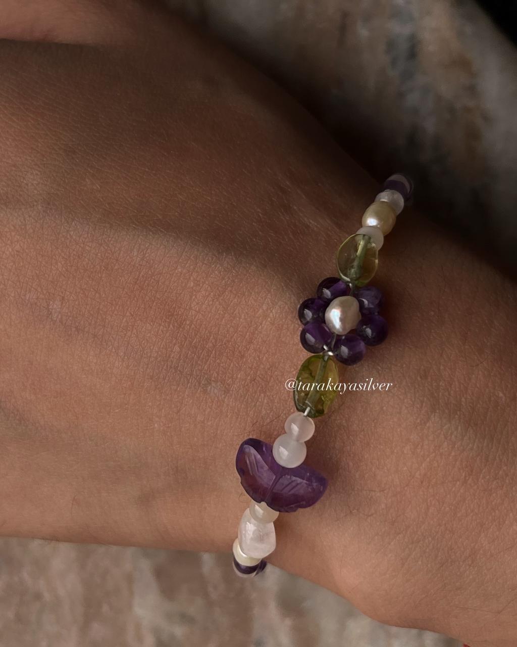 Handmade silver bracelet with colorful floral gemstone accents  