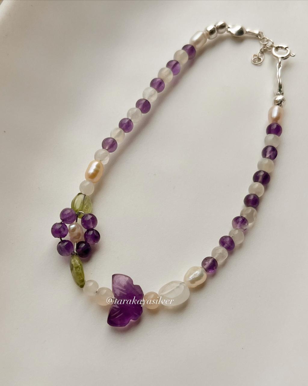 Handmade silver bracelet with colorful floral gemstone accents  