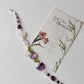 Botanical silver bracelet featuring delicate floral patterns  