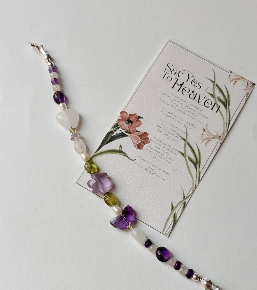 Botanical silver bracelet featuring delicate floral patterns  