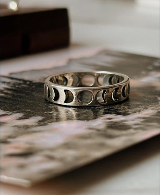 Celestial moon phases design on silver band ring